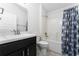 Clean bathroom with a bathtub, shower, and modern vanity at 220 Bergamot Loop, Davenport, FL 33837