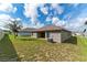 Spacious backyard with grassy area and privacy fence at 220 Bergamot Loop, Davenport, FL 33837