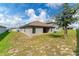 Large backyard with grassy area and privacy fence at 220 Bergamot Loop, Davenport, FL 33837