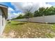 Landscaped backyard with privacy fence and ample space at 220 Bergamot Loop, Davenport, FL 33837
