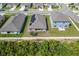 Aerial view of three homes in a residential area at 220 Bergamot Loop, Davenport, FL 33837
