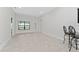 Spacious dining area with tile floors and access to the backyard at 220 Bergamot Loop, Davenport, FL 33837