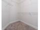 Walk-in closet with wire shelving and hanging rods at 220 Bergamot Loop, Davenport, FL 33837