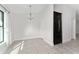 Bright breakfast nook with tile floors and a modern chandelier at 220 Bergamot Loop, Davenport, FL 33837