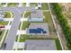 Aerial view of a house with solar panels on the roof at 220 Bergamot Loop, Davenport, FL 33837