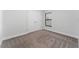 Simple bedroom with neutral walls, carpeting, and double door closet at 220 Bergamot Loop, Davenport, FL 33837