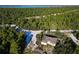 Aerial view of a home surrounded by trees near a body of water at 619 Alafia Pl, Poinciana, FL 34759