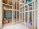 New home garage framing and door, showing electrical and plumbing at 619 Alafia Pl, Poinciana, FL 34759