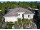 New construction home with block exterior and two-car garage at 619 Alafia Pl, Poinciana, FL 34759