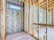 New home bathroom framing and plumbing showing a small window at 619 Alafia Pl, Poinciana, FL 34759