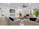 Open concept living room, kitchen, and dining area at 1603 Woodlyn Dr, Leesburg, FL 34748