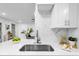 Sleek kitchen with stainless steel sink and quartz countertop at 1603 Woodlyn Dr, Leesburg, FL 34748