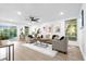 Bright living room with hardwood floors and comfy seating at 1603 Woodlyn Dr, Leesburg, FL 34748