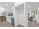 Bright kitchen features white cabinets, stainless steel dishwasher, and an open layout at 1603 Woodlyn Dr, Leesburg, FL 34748