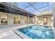 Inviting, refreshing pool with covered patio at 1603 Woodlyn Dr, Leesburg, FL 34748