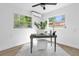 Bright home office with desk, chair, and ample natural light at 1603 Woodlyn Dr, Leesburg, FL 34748