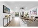 Spacious living room with hardwood floors and view of pool at 1603 Woodlyn Dr, Leesburg, FL 34748
