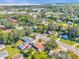 Aerial view of neighborhood, showcasing houses and surrounding landscape at 1603 Woodlyn Dr, Leesburg, FL 34748