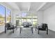 Relaxing sunroom with ample windows, seating area and view of backyard at 1603 Woodlyn Dr, Leesburg, FL 34748