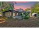 Home with screened pool and detached shed at 1603 Woodlyn Dr, Leesburg, FL 34748