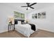 Bright bedroom with wood-look floors and ceiling fan at 1603 Woodlyn Dr, Leesburg, FL 34748