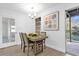 Charming dining area with wood table, chairs, and access to backyard pool at 1603 Woodlyn Dr, Leesburg, FL 34748