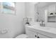 Clean bathroom with white vanity, toilet, and shower at 1603 Woodlyn Dr, Leesburg, FL 34748