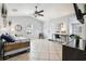 Open living room with a daybed, desk, and ceiling fan at 1815 Larkin Ave, Orlando, FL 32812