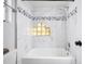Clean bathroom with a shower/tub combo and decorative tile at 1815 Larkin Ave, Orlando, FL 32812