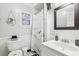 Updated bathroom features a marble shower, pedestal sink, and black and white tile floor at 1815 Larkin Ave, Orlando, FL 32812