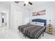 Bedroom with a queen bed, closet, and tiled floors at 1815 Larkin Ave, Orlando, FL 32812