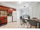 Bright kitchen with ample wood cabinets and white appliances at 1815 Larkin Ave, Orlando, FL 32812
