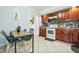 Well-equipped kitchen featuring wood cabinets and tiled backsplash at 1815 Larkin Ave, Orlando, FL 32812