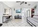 Living room with a daybed, TV, and a view of the kitchen and bathroom at 1815 Larkin Ave, Orlando, FL 32812