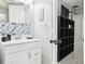 Bathroom with pedestal sink and patterned tile at 1815 Larkin Ave, Orlando, FL 32812