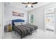 Bedroom with a queen bed, en-suite bathroom, and tiled floor at 1815 Larkin Ave, Orlando, FL 32812