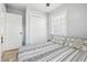 Bedroom with a queen bed and double door closet at 1815 Larkin Ave, Orlando, FL 32812