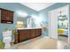 Bathroom with double vanity, toilet, and access to bedroom at 500 Arena Dr, Davenport, FL 33837
