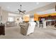 Spacious living room with beige couches and access to kitchen and backyard at 500 Arena Dr, Davenport, FL 33837