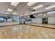 Spacious fitness room with hardwood floors and mirrors at 500 Arena Dr, Davenport, FL 33837