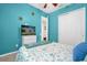 Bright bedroom with teal walls, a double bed, and ample closet space at 500 Arena Dr, Davenport, FL 33837
