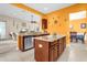 Kitchen with island and view into living room at 500 Arena Dr, Davenport, FL 33837