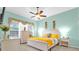 Bright bedroom with a queen bed, dresser, and window coverings at 500 Arena Dr, Davenport, FL 33837