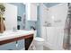 Bathroom with walk-in shower and single vanity at 500 Arena Dr, Davenport, FL 33837
