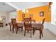 Dining room with wood table and chairs, and view to living room at 500 Arena Dr, Davenport, FL 33837