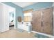 Bathroom with bathtub, shower, and view into bedroom at 500 Arena Dr, Davenport, FL 33837