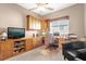 Home office with built-in cabinetry, desk, and seating at 500 Arena Dr, Davenport, FL 33837