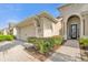 House exterior with double garage and walkway at 500 Arena Dr, Davenport, FL 33837