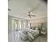 Luxurious main bedroom with a king-size bed and marble floors at 2393 Appy Ln, Apopka, FL 32712