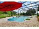 Relaxing pool area with a covered patio and plenty of space for entertaining at 2393 Appy Ln, Apopka, FL 32712